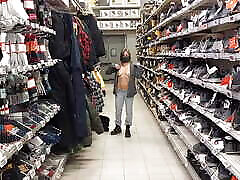 Topless woman trying clothes in the store!