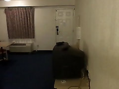 Crossdresser walking in motel room