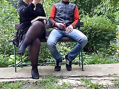 Curvy mother-in-law jerks off her son-in-law in the park while reading a book