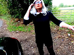 Amateur crossdresser Kellycd2022 in black dress and pantyhose outdoors