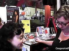 MILF plays with her stepdaughters pussy in the shop