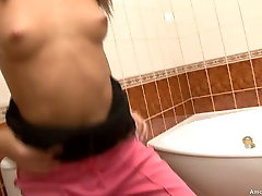 Tempting babe Elionor fondles her pussy in the bathroom in solo video