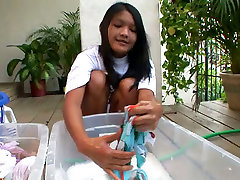 Kat amy agent is washing her clothes in front of cam outdoor