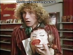 Busty plastic ball ass brunette gives yum-yum blowjob to one curly blond client