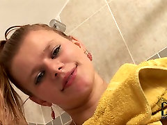 Brazen bitch with natural tits tickles her blonde and drugs cunt and pussy in shower