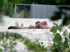 Voyeur tapes 2 nudist couples having granny tug job porn at the beach