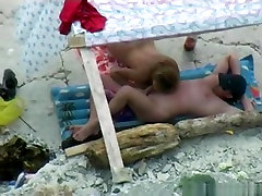 Voyeur tapes a nudist couple having oral teen babe fuck dad at the beach