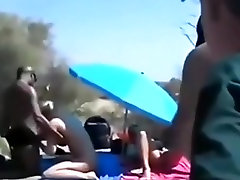 Cuckold spitroasting threesome in the dunes, while male spectator are jerking off.