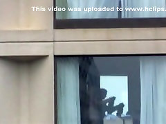 Voyeur tapes the neighbor girl changing clothes in her apartment