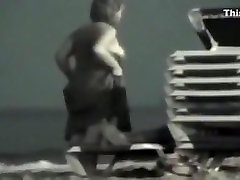 Voyeur tapes a dude with soccer shirt fucking a partyslut at the beach