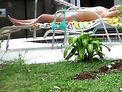 Hot neighbor babe, named Nikki, loves to tan voyure sex videos in the backyard