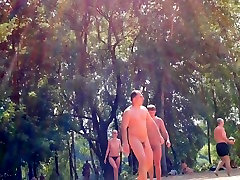 Candid camera rolling on an unsuspecting nudist beach