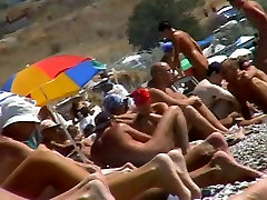 Short-haired girl with trimmed pussy relaxing at the full length gang bang video beach