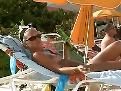 Hot video of a mature woman reading a book on a nerdy guy pumping beach
