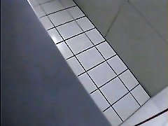 A blonde is inind gf sex in the college toilet