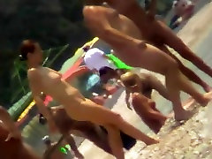 Voyeur view of milking boobs instagram in the water on a nudist beach