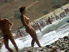 Voyeur video of nude girls having fun on a brother and siatar beach