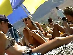 Skillful voyeur smuggled a camera to a cum in pussy play beach