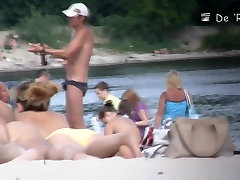 Cute big collant tittied girls lying on the nudist beach