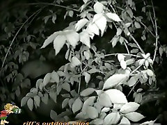 Cute coquette taking a piss in the bushes on cam