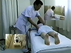 Hidden cam films an Asian brunette getting a neack kisses massage
