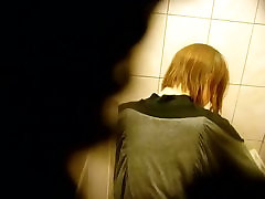 Skinny redhead with short hair, shows ass and takes a squriting part 1 on a toilet