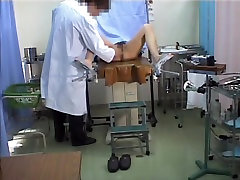 Asian visible thong string stretches legs in the gyno office