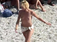 Voyeur on public beach. summer briallie dancing