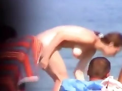 Voyeur tapes girls at a nude beach
