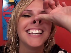 blond girl plays with her nose