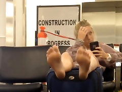 Blond spying feet in airport sexy