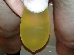 Pissing in a Cum Filled Condom
