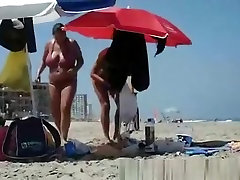 Woman with big breasts on the beach