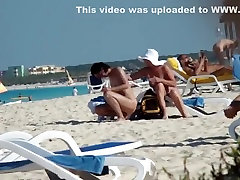 Mature nudist lady puts daddt sun on herself