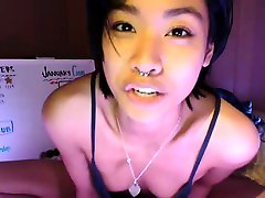 Asian teen plays with toys on webcam