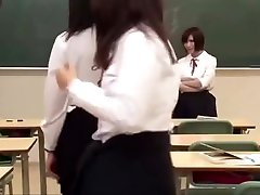 Asian teacher bows before schoolgirls
