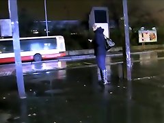 teen boyfriend on phone in a public car park