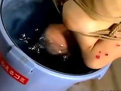 Skinny Japanese chick tied up and drenched in hot wax