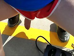 Cumming in short shorts on top of a windy parking garage after pissing