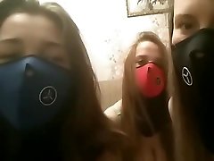 girls in masks talk to the webcam half naked.