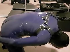 rubber gimp being used by a fucking machine