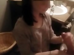 Hand easing her into anal in Toilet