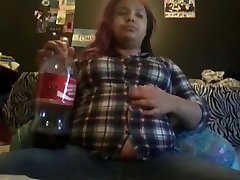 Coke bloat , bursting out of button up shirt