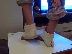 Girl in sneakers trample on cock and balls. Ends bootjob and cumshot