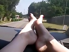 Sexy barefoot car ride