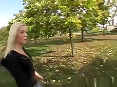 Sexy blonde shows off tits outdoor in public