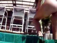 Lesbian girlfriends having fun by the pool