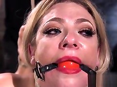 Gagged blonde in extreme fuck in souna bondage