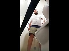 spying men pissing in toilets
