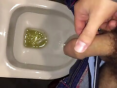 pissing in a public restroom
